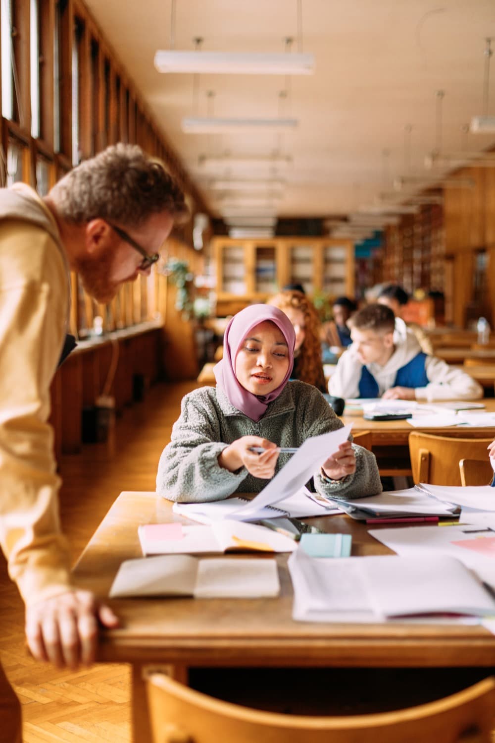 A student talking through an idea with a teacher